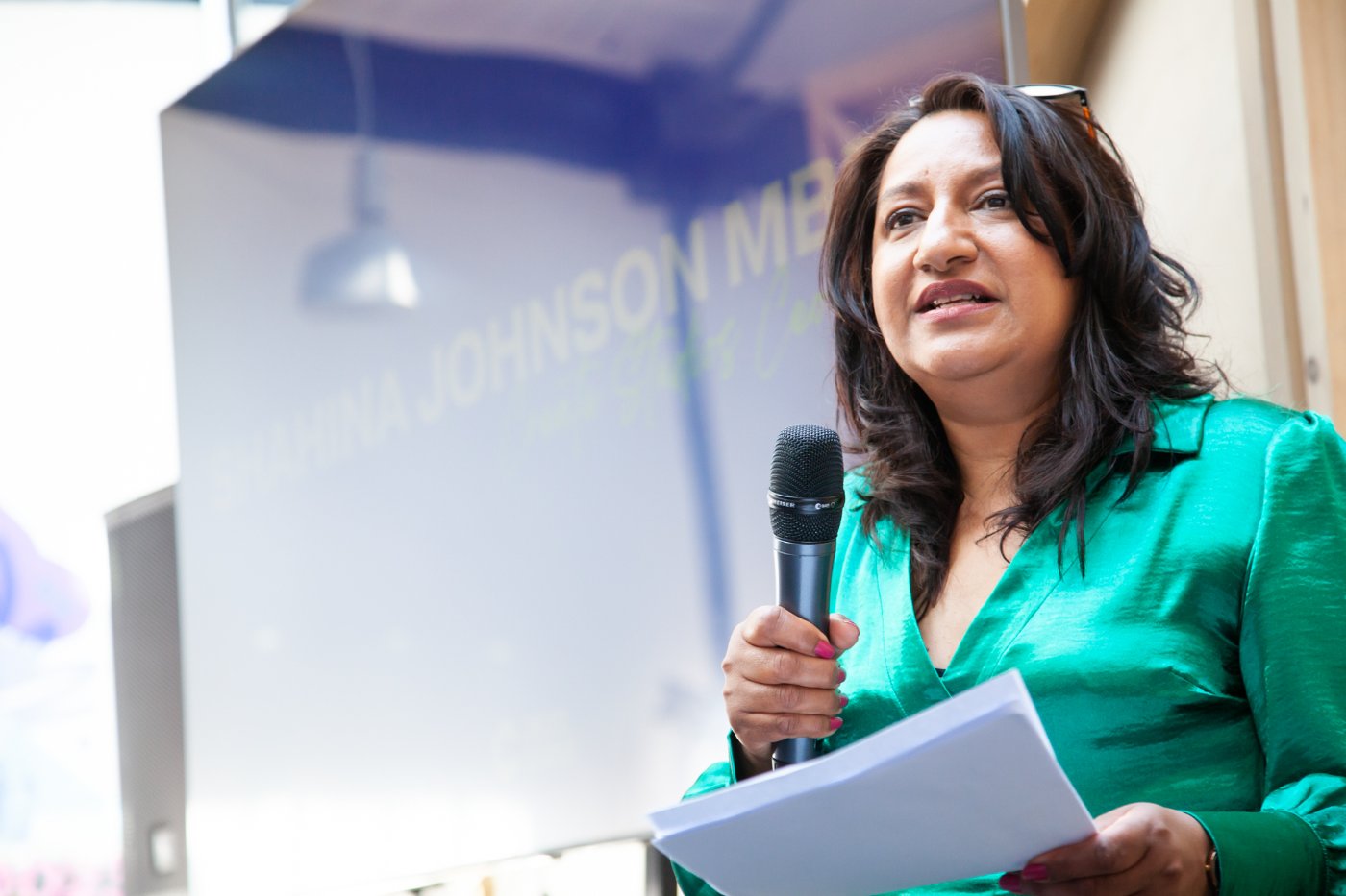Lady on stage with a mic
