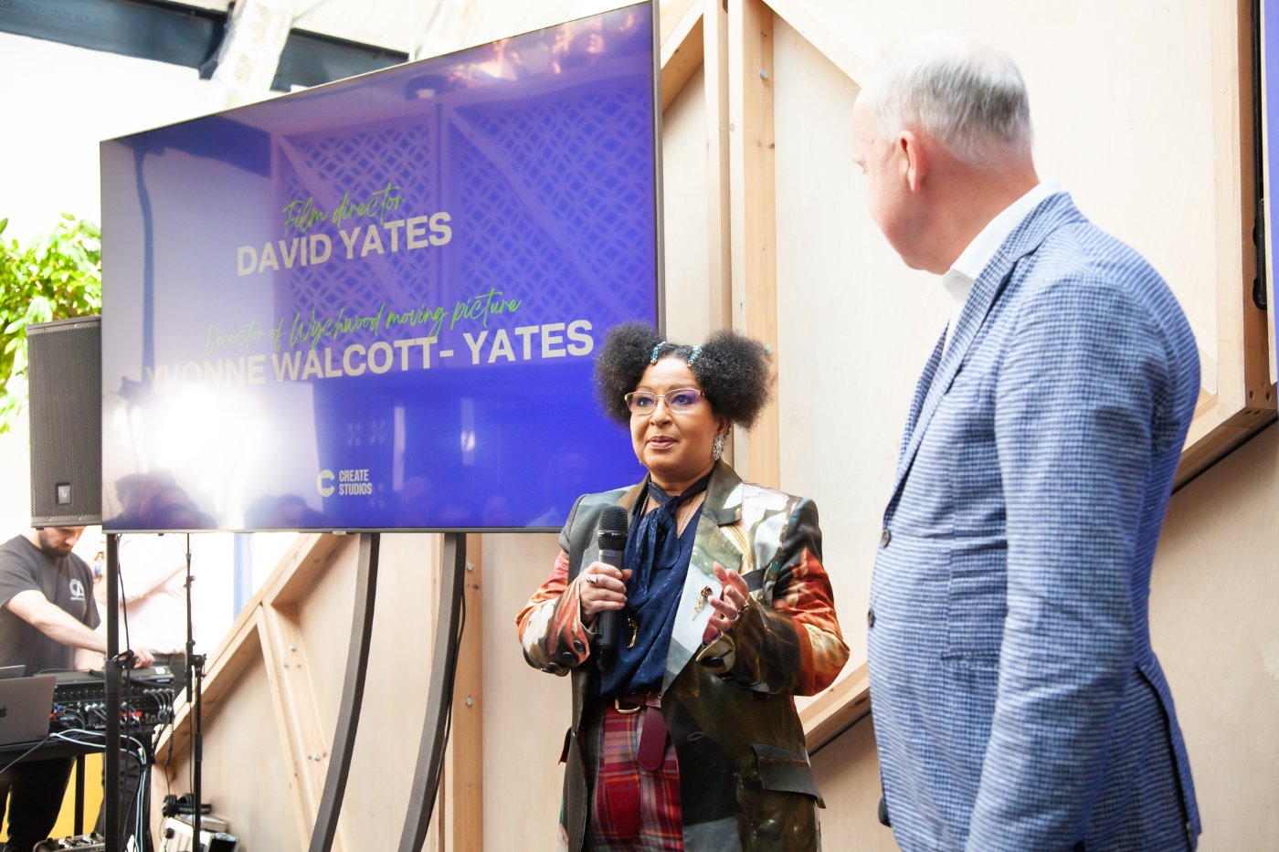 Two people talking on stage