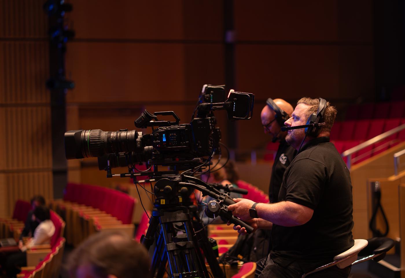 Camera crew filming the stage
