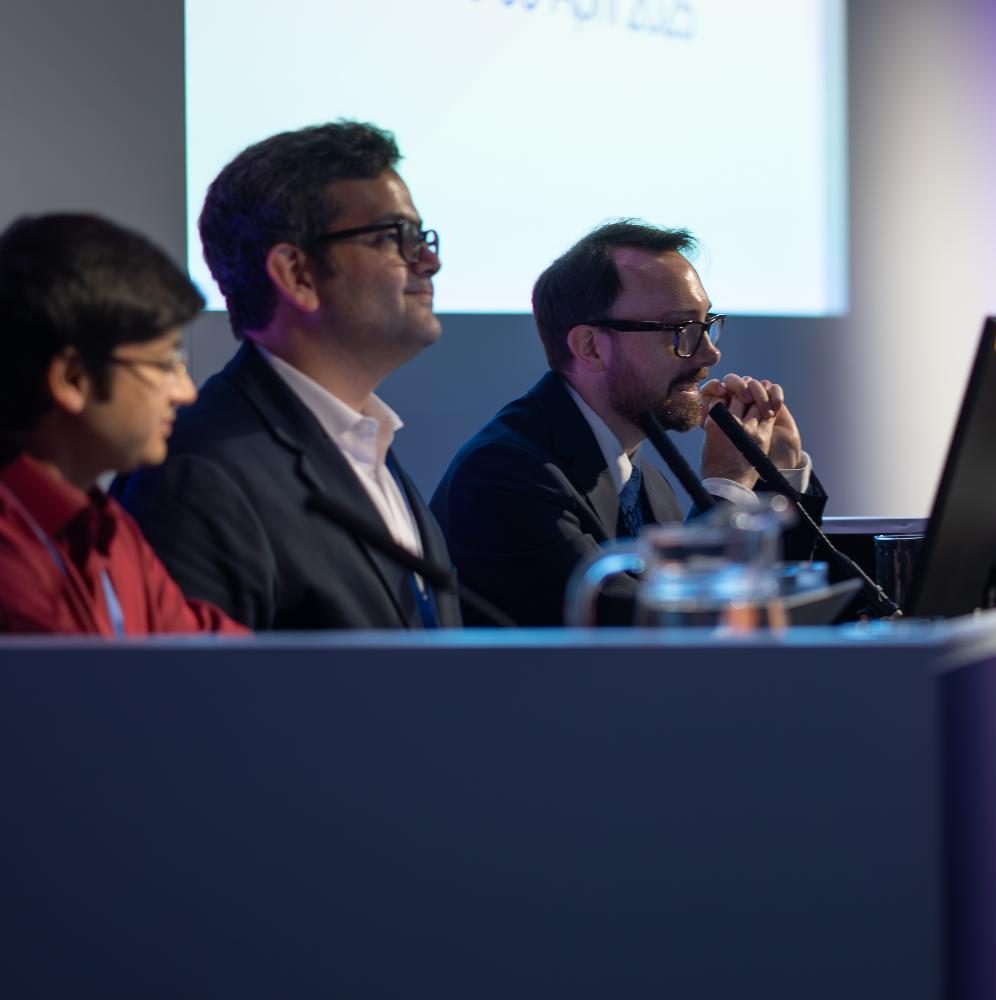 Members of an event panel on stage.