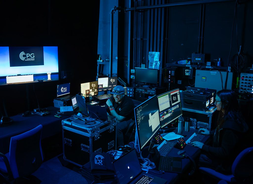 Event production team surrounded by technical equipment