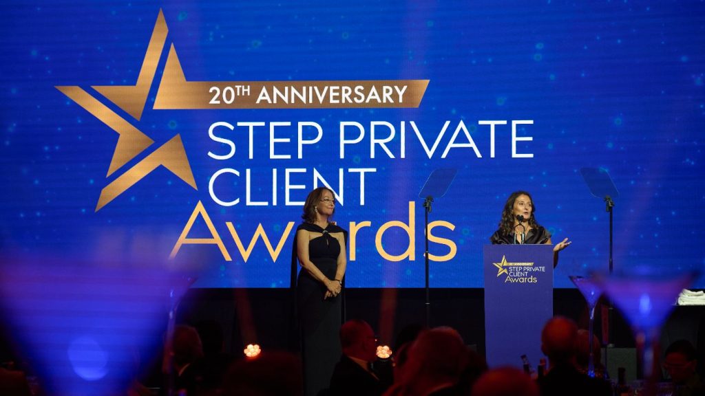Award winner on stage talking to the audience
