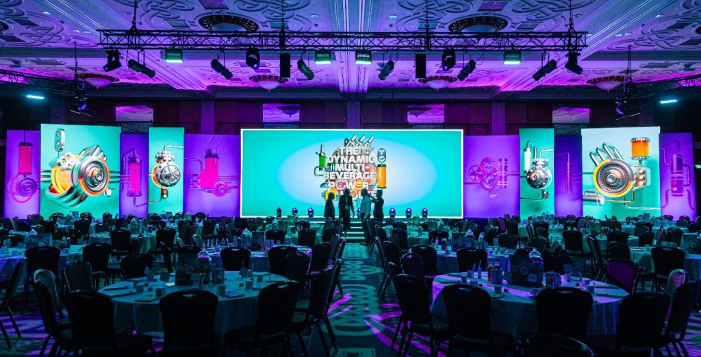 The stage and table layout for a large corporate event.
